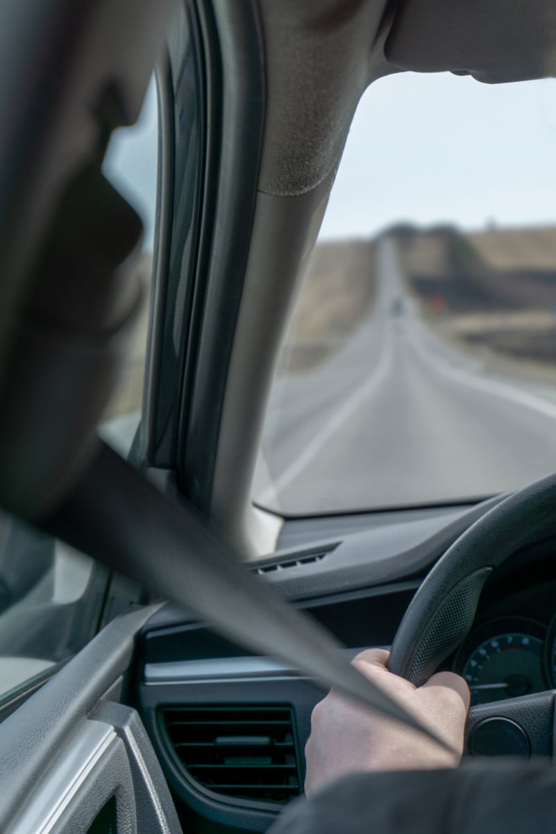 driver rides on the road by car